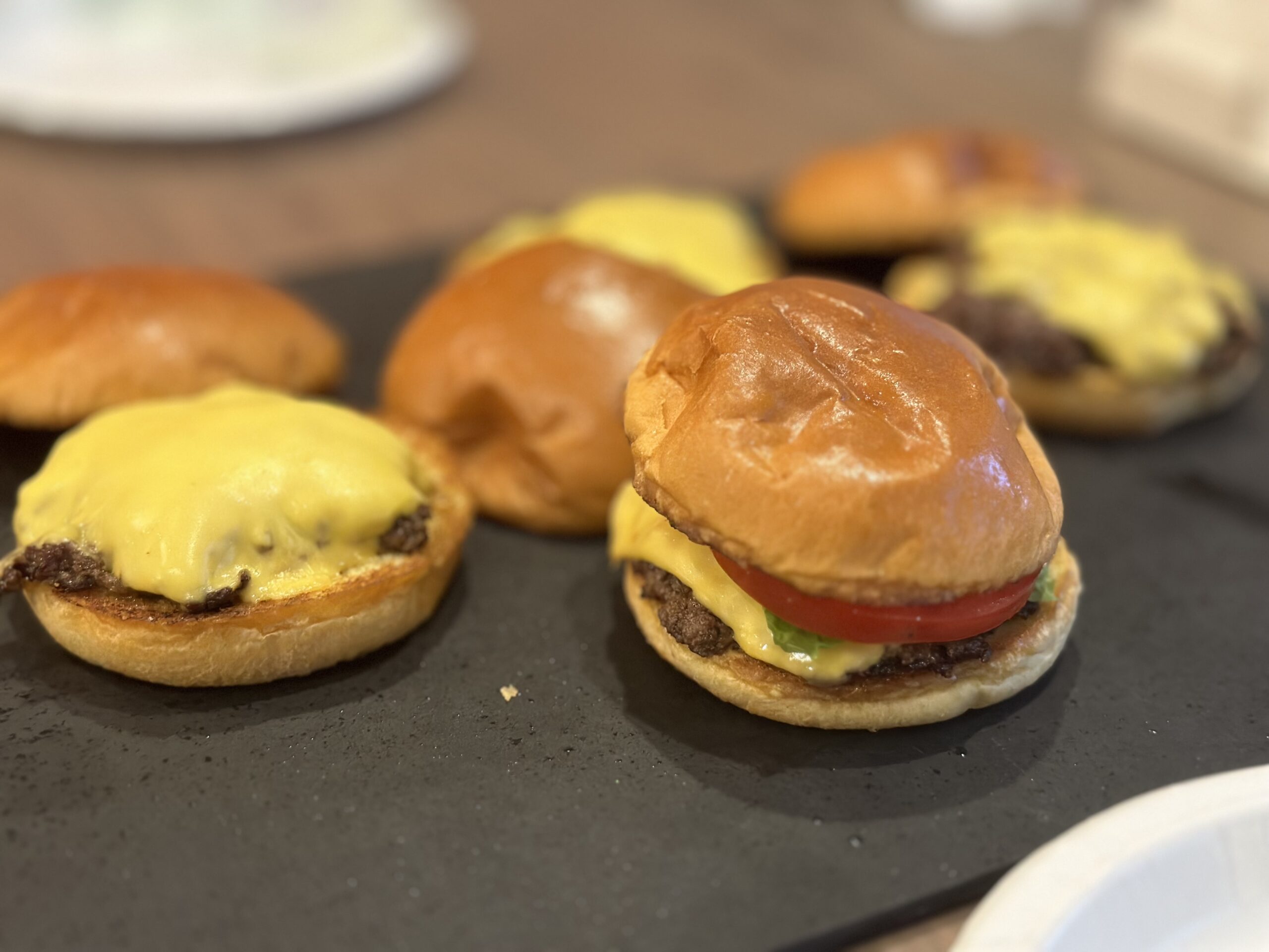 Juicy smash burgers served on toasted brioche buns with melted cheese.